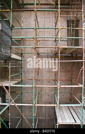 Scaffolding used in the construction of a concrete building Stock Photo