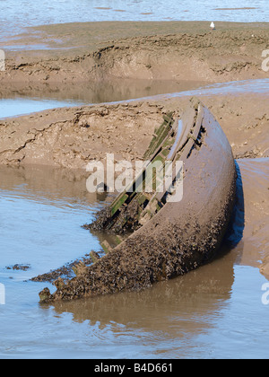 Old boat sunk in mud in estuary rotting in water Stock Photo - Alamy