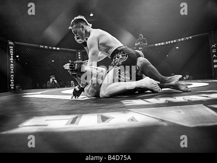 Cage Fighters in action during a Cage Wars competition held at Brahead arena in Glasgow MMA Fighters Mixed Martial Arts fighters Stock Photo