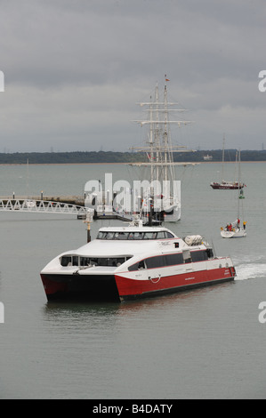 Red Funnel Catamaran crossing the Solent, between Cowes, Isle of Wight and Southampton UK Stock Photo