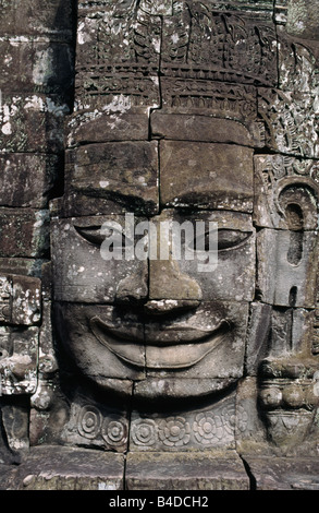 The smile of Angkor. Sculpted from stone, the smiling faces at Bayon temple are a symbol of Angkor, near Siem Reap, Cambodia. Stock Photo