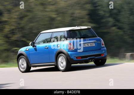 Mini Cooper S, model year 2006-, blue moving, diagonal from the back, rear view, side view, country road Stock Photo