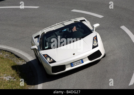 Lamborghini Gallardo Spyder, model year 2005-, white, driving, diagonal from the front, frontal view, country road, open top Stock Photo