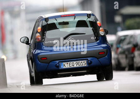Citroen C1 HDi 55 Style, model year 2007-, blue moving, diagonal from the back, rear view, City Stock Photo