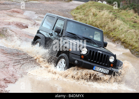 Jeep Wrangler Rubicon 3.8, model year 2008-, black, driving, diagonal from the front, frontal view, offroad, Water Stock Photo