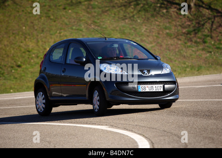 Peugeot 107 Urban Move, model year 2005-, anthracite, driving, diagonal from the front, frontal view, test track Stock Photo