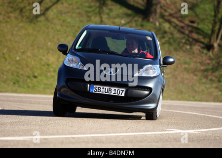 Peugeot 107 Urban Move, model year 2005-, anthracite, driving, diagonal from the front, frontal view, test track Stock Photo
