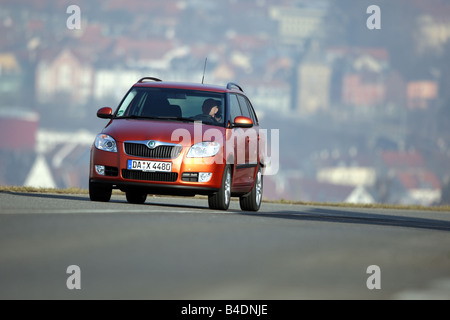 Skoda Fabia Combi 1.9 TDI Sport, model year 2007-, orange -metallic, rust-red, driving, diagonal from the front, frontal view, c Stock Photo