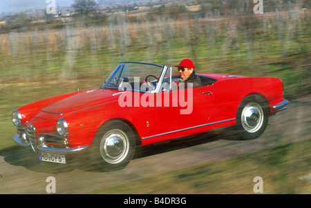 Car, Alfa Romeo Guilietta Spider, Convertible, Vintage approx., model year 1955-1962, 1950s, sixties, red, driving, diagonal fro Stock Photo