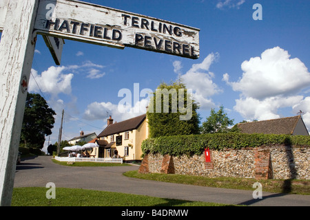 village signpost and the Square Compass pub Fairstead Essex England Stock Photo