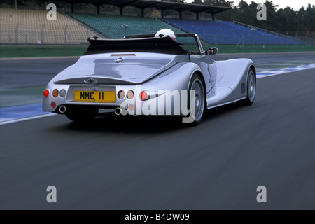 Car, Morgan Aero 8, Convertible, model year 2000, silver, driving, test track, diagonal from the back, rear view, open top Stock Photo