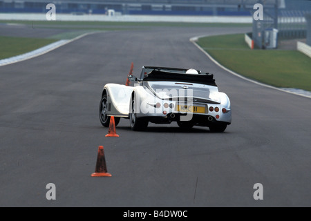 Car, Morgan Aero 8, Convertible, model year 2000, silver, driving, test track, diagonal from the back, rear view, open top Stock Photo