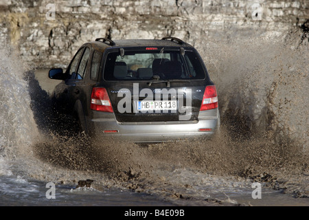 Car, Kia Sorento, cross country vehicle, model year 2002-, black, FGHDS, driving, Groand, offroad, diagonal from the back, rear Stock Photo
