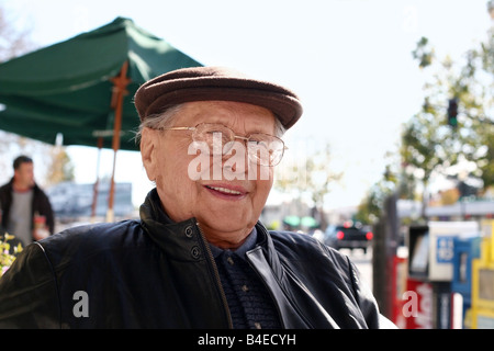 Senior man enjoying a sunny day in the city Stock Photo