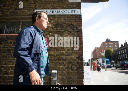 Smoker in street in London Stock Photo