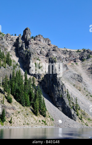 The Devil's Backbone, a vertical dike cut across the rim. The Crater Lake National Park, Oregon, USA. Stock Photo