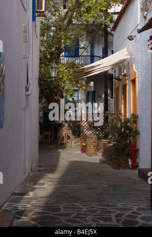 Typical Greek Alleyway Leading to Traditional Grecian Houses in Batsi Town Isle of Andros Cyclades Islands Greece Stock Photo