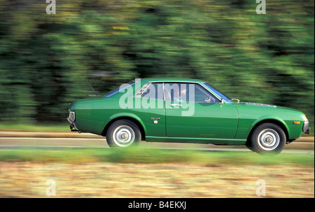 Car, Toyota Celica, Coupé, Coupe, green, model year 1971-1977, old car, 1970s, seventies,  driving, side view, road, country roa Stock Photo