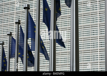 European flags in the wind fronting the Berlaymont building in Brussels in the Schuman area Stock Photo