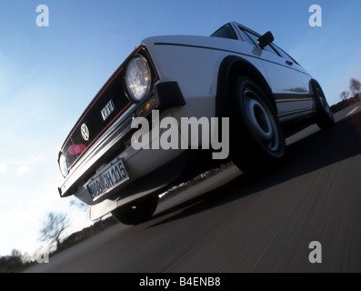 Car, VW, Volkswagen, Golf GTI MK1, white, model year 1977, 1970s, seventies, old car, sedan, standing, diagonal front ,  below, Stock Photo