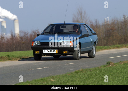 Car, Renault Fuego, model year approx. 1984, blue, old car, 1980s, eighties, driving, diagonal front, front view, road, country Stock Photo