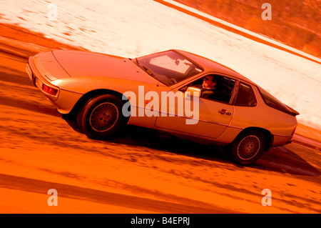 Car, Porsche 924, model year 1977, Coupé ,  Coupe, old car, driving, side view, road, country road, photographer: Hardy Mutschle Stock Photo