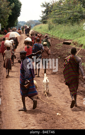 Nomadic Karamojong on dirt road, Karamoja, Uganda Stock Photo