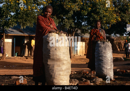 Karamojong villagers with filled gunny ssacks, Karamoja, Uganda Stock Photo