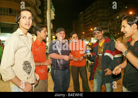 Young Iraqi refugees socialising on streets, Cairo, Egypt Stock Photo