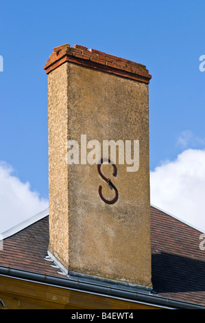 Decorative letter 'S' reinforcing chimney stack, France. Stock Photo