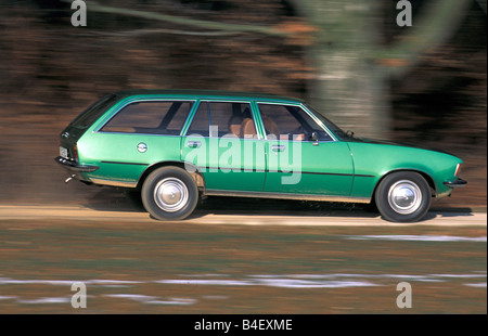 Car, Opel Rekord D 2000 Caravan, wagon, model year 1972-1977, old car,  green, driving, side view, road, country road Stock Photo