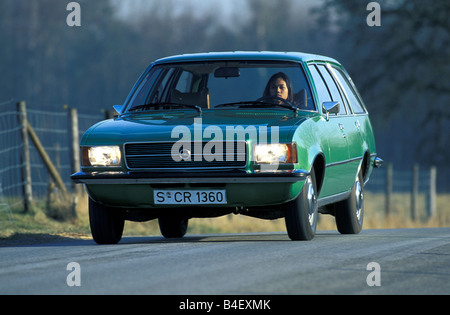 Car, Opel Rekord D 2000 Caravan, wagon, model year 1972-1977, old car,  green, driving, diagonal front, front view, road, countr Stock Photo