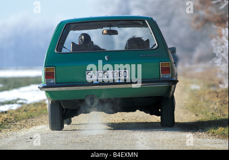 Car, Opel Rekord D 2000 Caravan, wagon, model year 1972-1977, old car,  green, driving, back view, road, country road Stock Photo