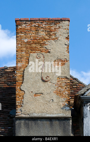 Decorative letter 'F' reinforcing chimney stack, Bélabre, France. Stock Photo