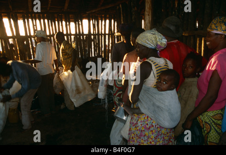 Food distribution at a displaced people's camp in Angola. Stock Photo