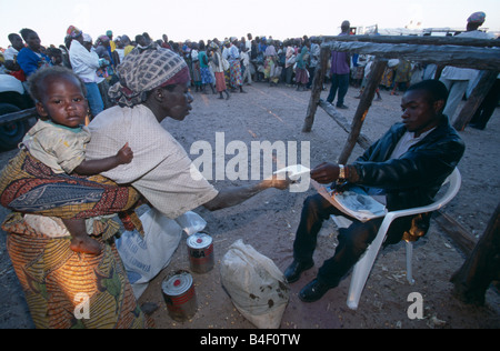 Distribution of relief supplies at a displaced people's camp in war-ravaged Angola. Stock Photo
