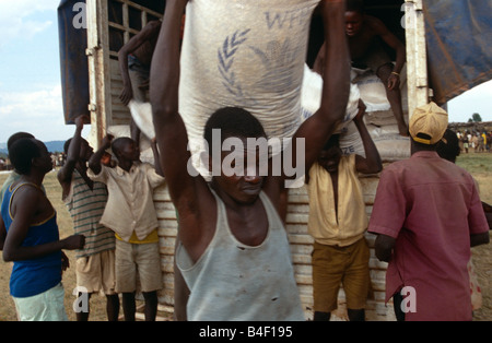 Unloading sacks of WFP supplies for distribution in Burundi. Stock Photo