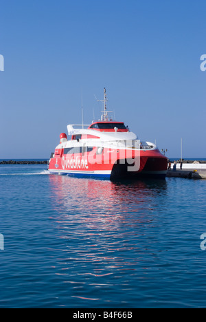 Hellenic Seaways Flyingcat 3 Fast Catamaran Passenger Ferry Departing Tinos Town Harbour Tinos Island Cyclades Islands Greece Stock Photo