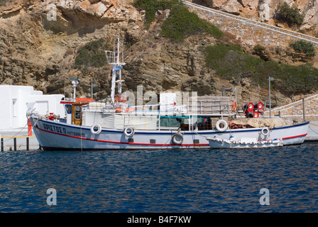 A Large Greek Fishing Boat Tied Up in Harbour at Platis Gialos Isle of Sifnos Aegean Sea Cyclades Islands Greece Stock Photo