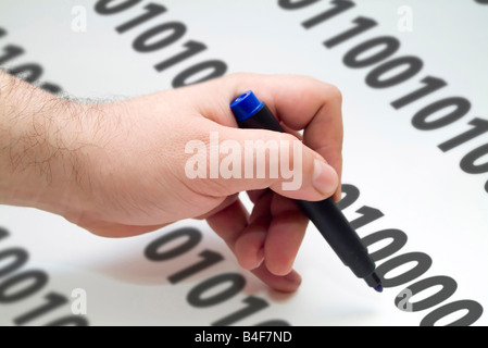 hand with blue pen writing binary code Stock Photo