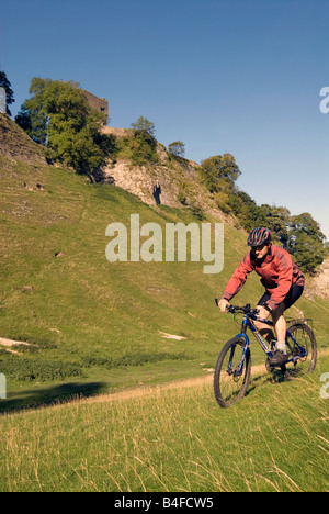 Mountain biking through Cavedale Castleton Peak District National Park Derbyshire England UK GB Stock Photo