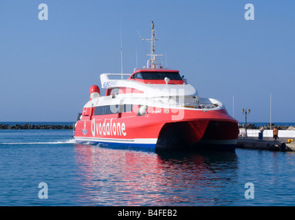 Hellenic Seaways Flyingcat 3 Fast Catamaran Passenger Ferry Departing Tinos Town Harbour Tinos Island Cyclades Islands Greece Stock Photo