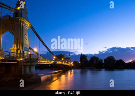 Hammersmith Bridge over Thames River at night Hammersmith London W6 United Kingdom Stock Photo