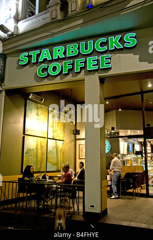 Man drinking coffee at Starbucks cafe in downtown Montreal Stock Photo ...