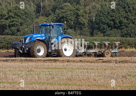 New Holland Tractor Ploughing Wheat Stubble Stock Photo