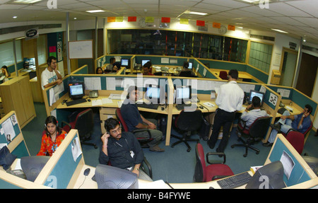 Workers in their own cubicles at an Indian Call centre in New Delhi India July 2002 Stock Photo