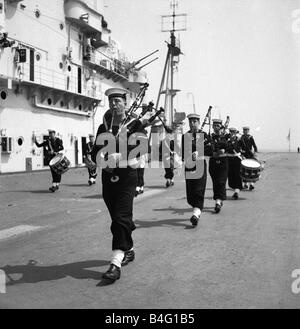 Pipers on board the Aircraft Carrier HMS Illustrious 1950 Stock Photo