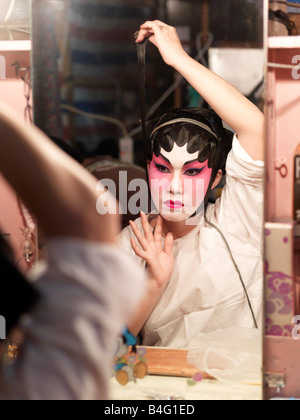 A Chinese opera performer prepares for a performance at the  A Ma Temple Festival in Macau. Stock Photo