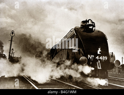 Dominon of Canada steam locomotive June 1938 leaving London Kings Cross for Edinburgh on the East Coast Line Stock Photo