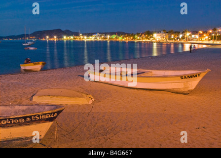 People, boats on beach at night at Malecon in La Paz, Baja California Sur, Mexico Stock Photo